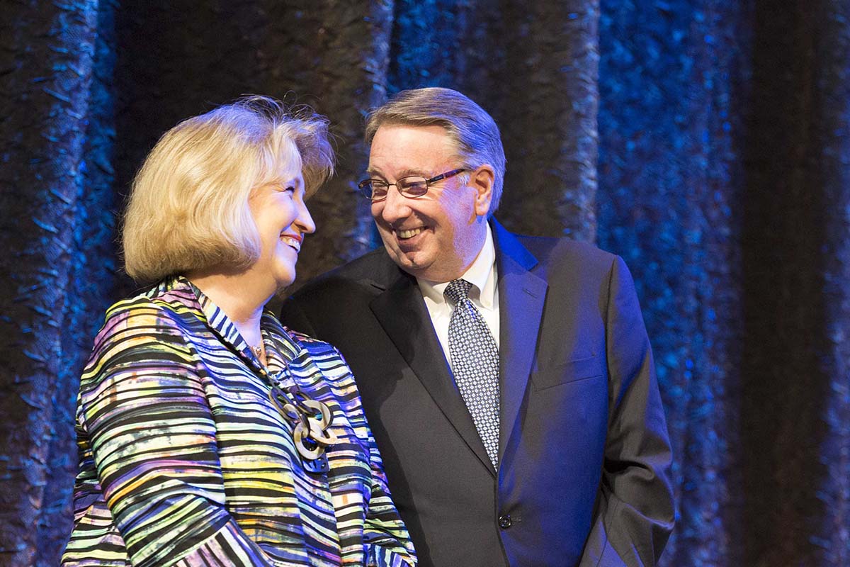 Randy and Rhonda Lowry smiling on stage