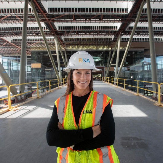Traci Holton in airport under construction