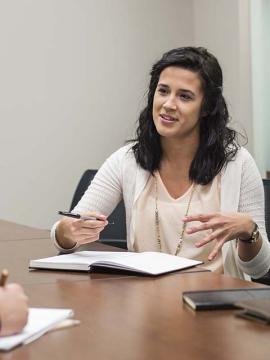 two people talking at a table