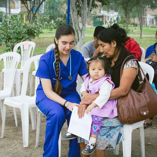 A student works on a medical mission in Peru.