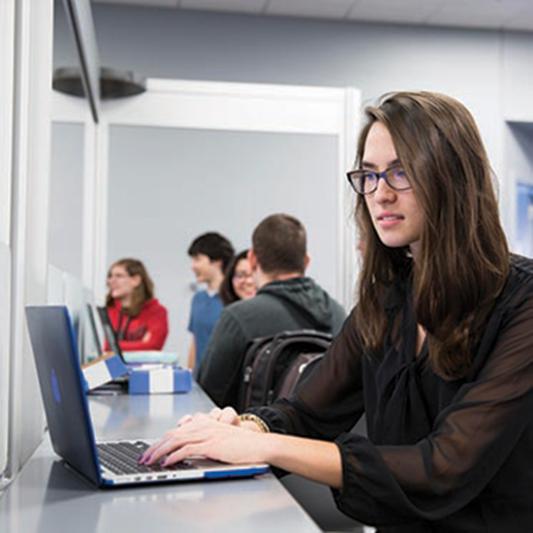 student with computer