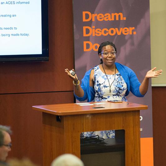 A student gives a presentation on her findings during Student Scholars Symposium.