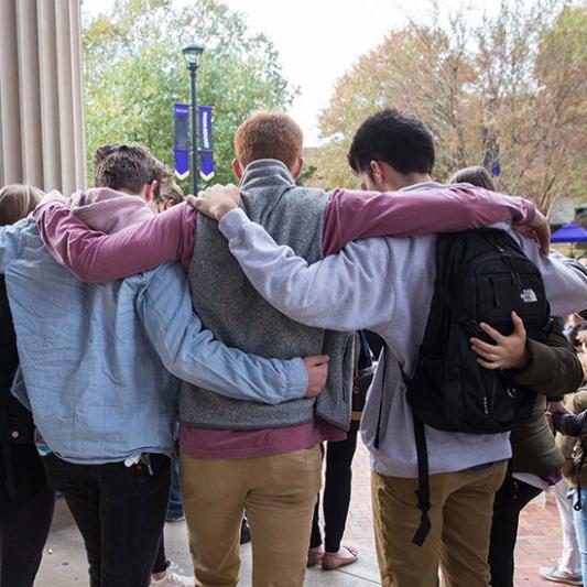 Students pray together in the center of campus.