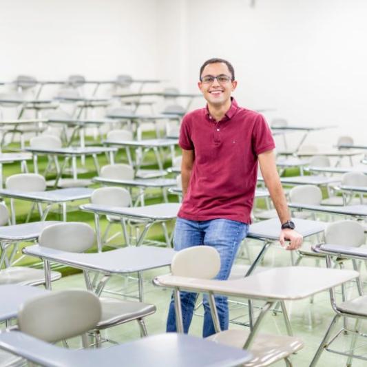 Guy sitting on a desk