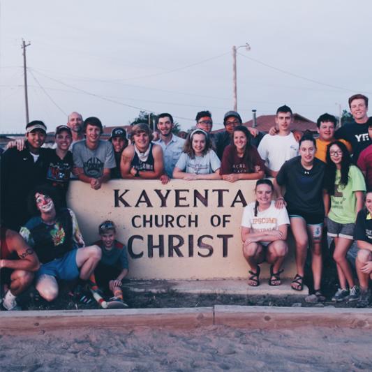 Lipscomb Academy students pose in front of Kayenta Church of Christ in Arizona.