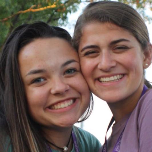 two girls smiling