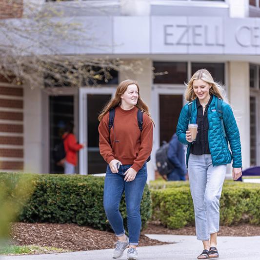 Students walking past Ezell Center