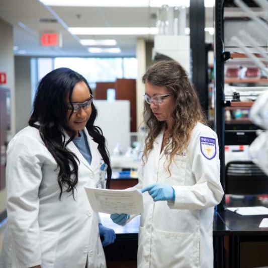Rachel Crouch with a student in the lab