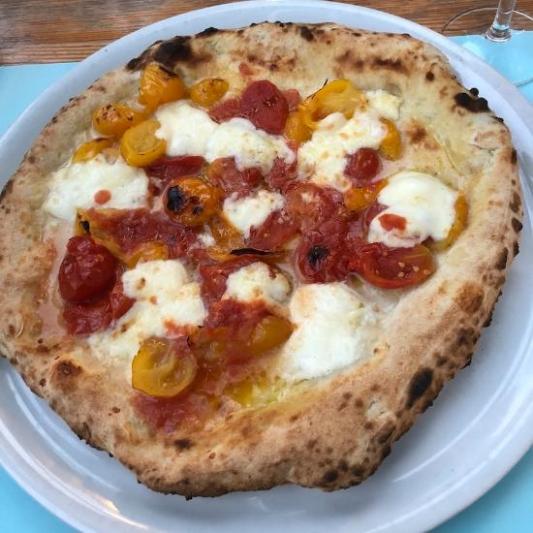 Italian mozzarella and tomato pizza on a plate