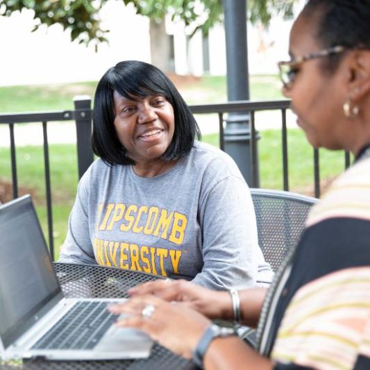 A veteran student applying to Lipscomb on a laptop