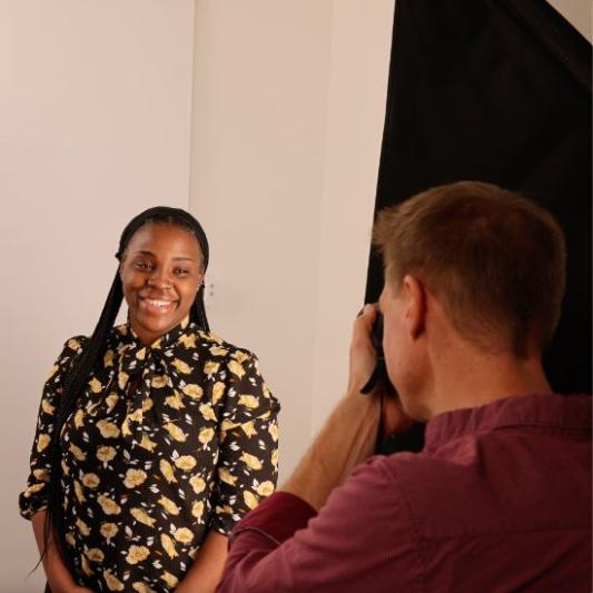 Student smiling at camera for headshot photo