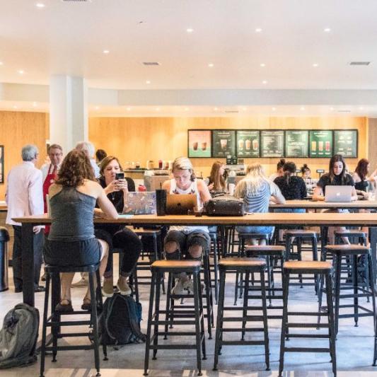 Students sitting at the Starbucks in the Food Court