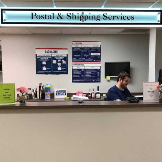 Students visiting the postal service window