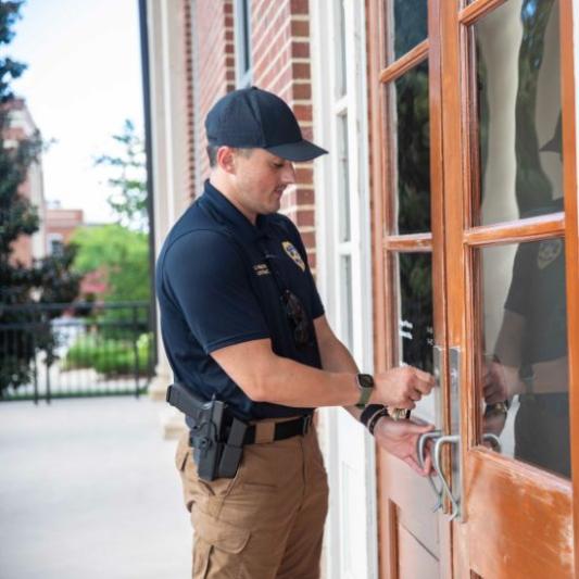 Officer Locking a Door