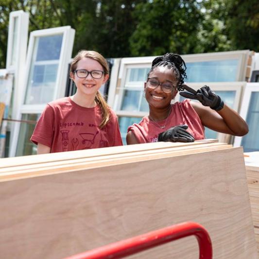 2 female students at service day