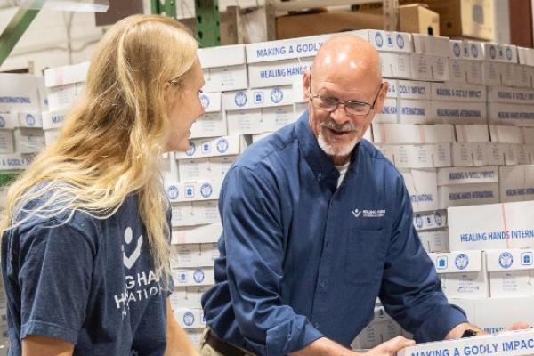 Healing Hands employees packing MAGI boxes